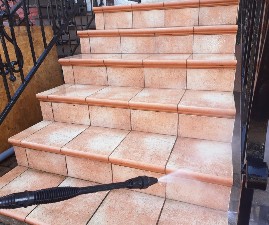 Sutherland power washing tile stairs