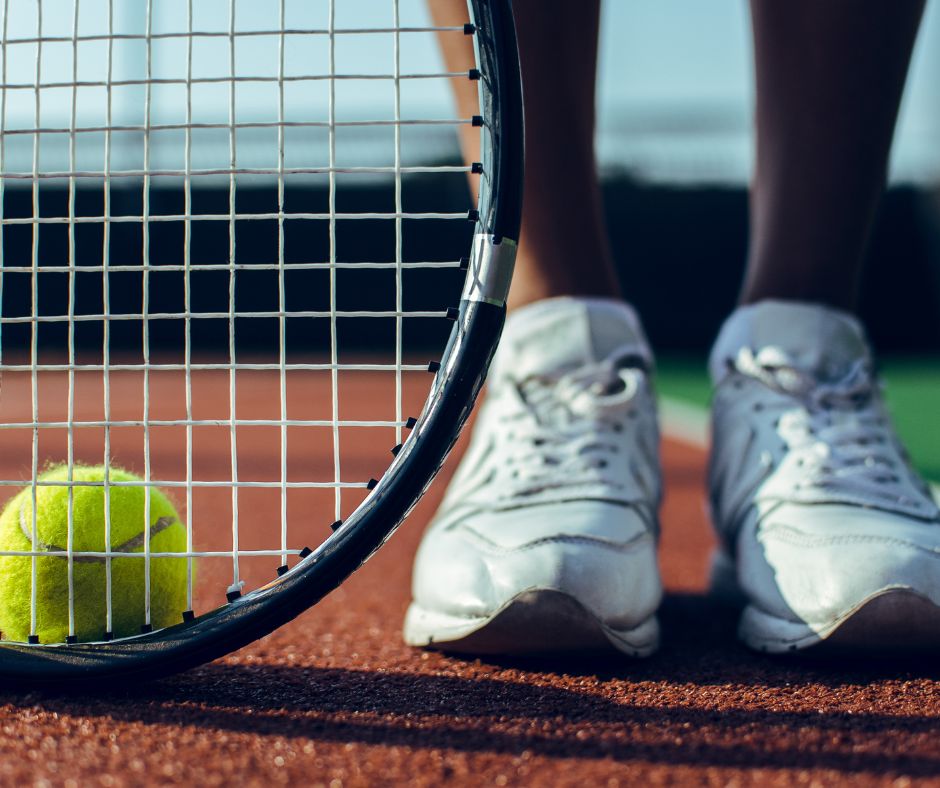 Tennis Player Standing On Clean Tennis Court
